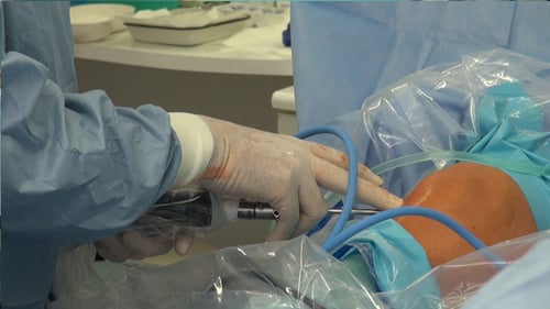 Surgeon Performing Arthroscopic Knee Surgery