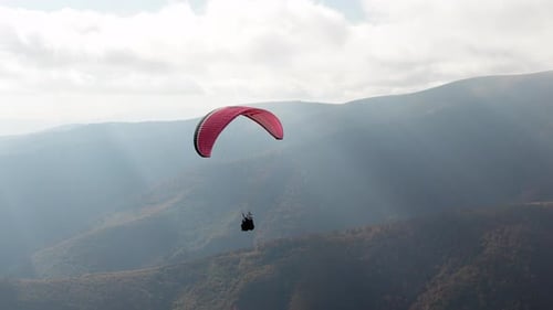 Paragliding Active Sport Against Giant Mountains in Highland