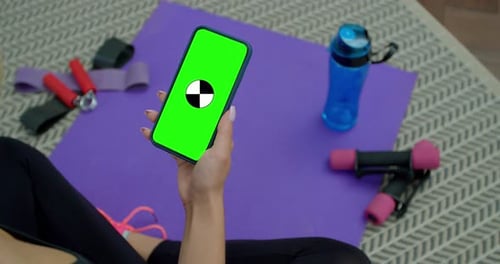 Tired Fitness Woman Use Smartphone with Green Screen After Training at Home. Workout, Training