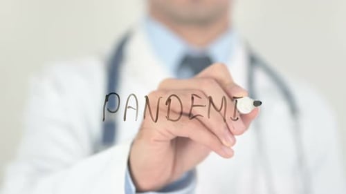 Doctor Writes Pandemic on Glass Surface