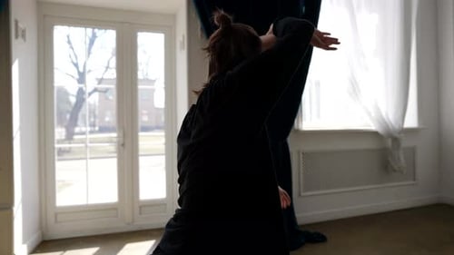 Elegant Couple Dancing Modern Style in Bright Studio