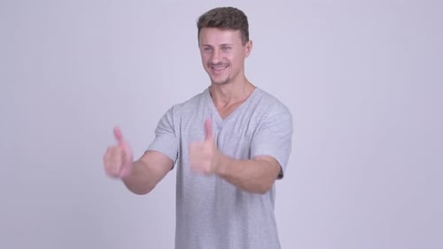 Smiling Man Giving Two Thumbs Up Sign