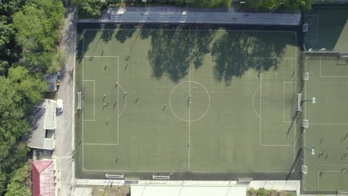 Football Stadium in the City Between the Blocks Drone View