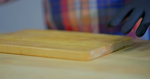 Chef Cuts Fresh Parsley on Cutting Board