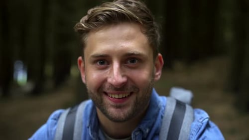 Portrait of smiling hiker in the forest