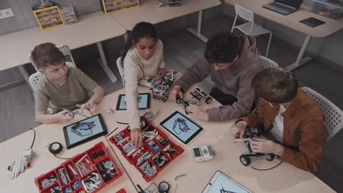 Group Of Kids Building Robots