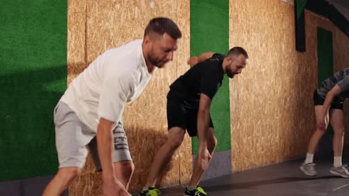 Men Training in Fitness Gym