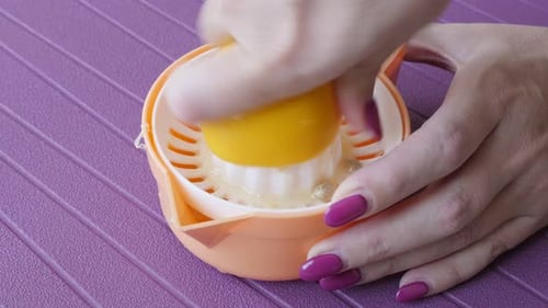 Using manual citrus juicer for healthy drink close-up 4K 3840X2160 UltraHD footage - Lemonade extrac