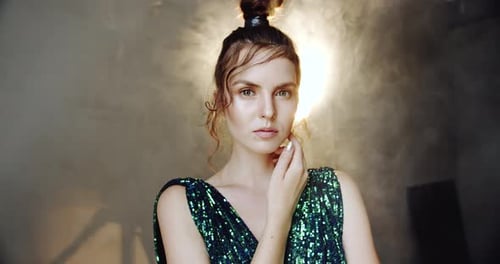 Woman Posing in Sparkling Dress in Studio
