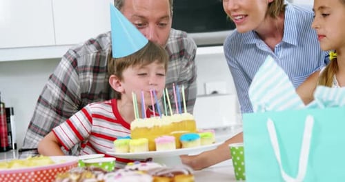 Family Celebrates Boy's Birthday in Bright Kitchen