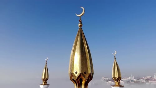 Golden crescent on the minaret of the mosque.