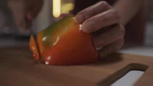 Slicing a Bell Pepper on a Cutting Board