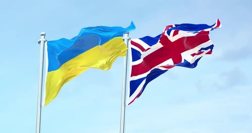 Ukraine and United Kingdom Flags Waving