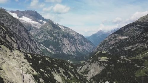 Wonderful Mountain Ranges Filled with Lush Green Trees and Sky in Background