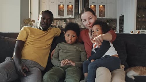 Happy Family Relaxing Together on Couch