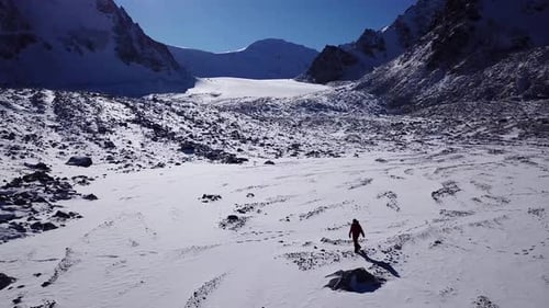 Snowy Mountains Hiker in Winter Landscape