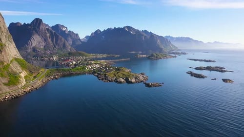 Flight over the sea and view on the fishing village Reine and Hamnoya ,Lofoten Islands,Norway