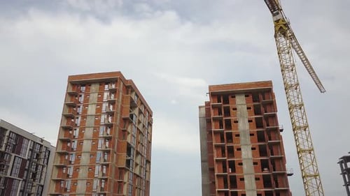 Aerial view of tall residential apartment buildings under construction. Real estate development.