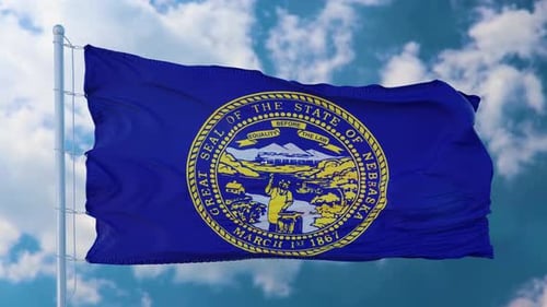Nebraska State Flag Waving on a Clear Sky Background