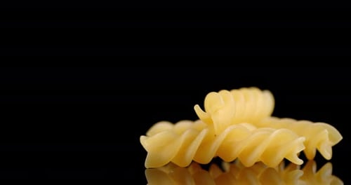 Fusilli Pasta Dry on the Table Slowly Rotates