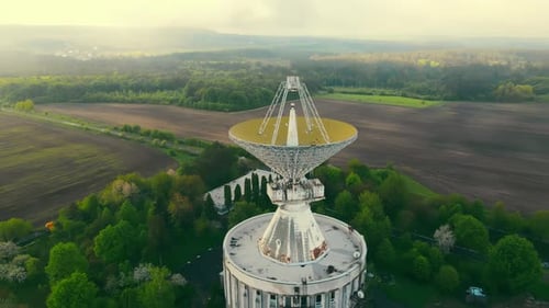 Large Satellite Dish in Rural Landscape Aerial Footage