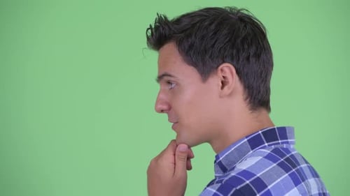 Closeup Profile View of Happy Young Handsome Hipster Man Thinking