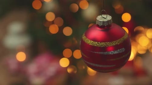 Christmas Ornament Close Up with Yellow Bokeh Lights