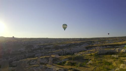 Hot Air Balloons Float Over Cappadocia Landscape