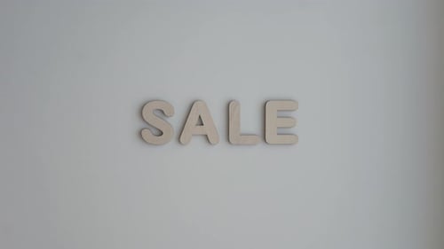 SALE Spelled Out with Wooden Block Letters