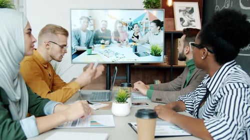 Adults in Meeting Having a Video Conference