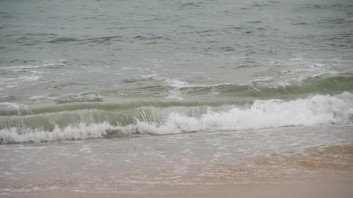 Waves Crashing on a Sandy Beach