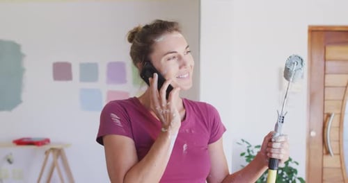 Woman on Phone During Home Renovation Project
