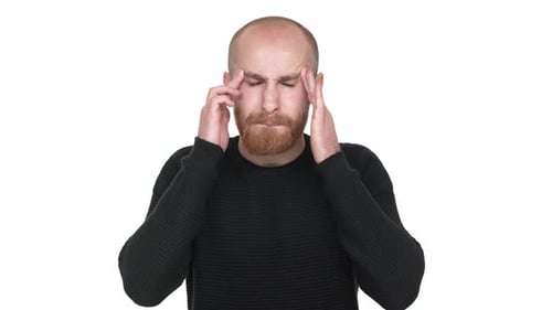 Man With Headache Massaging Temples