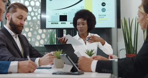 Business Meeting Presentation in Modern Office