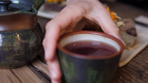 Tea and Cake with Edible Flowers Close Up