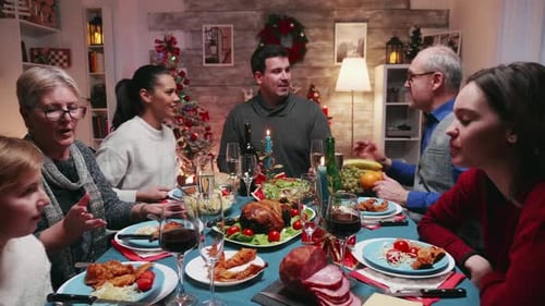Family Christmas Dinner Toasting Together at Home