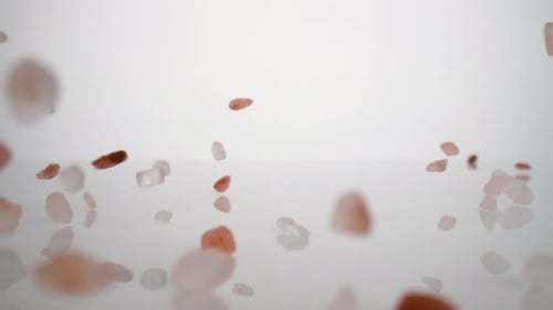 Pink Himalayan Salt Rocks Poured on Surface