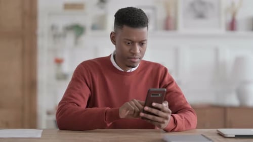 Man Reacts Negatively to Content on Smartphone