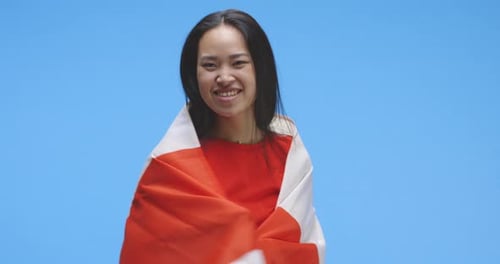 Smiling Woman Holding Canadian Flag