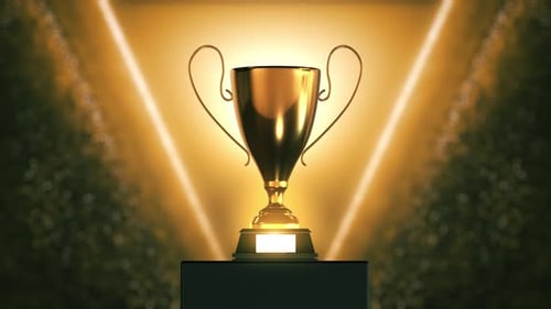Golden Trophy Rotating on Pedestal with Bright Spotlights