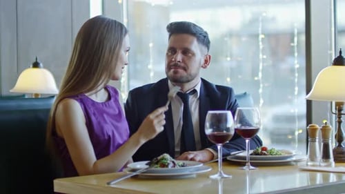 Woman Sharing Food with Man on Date