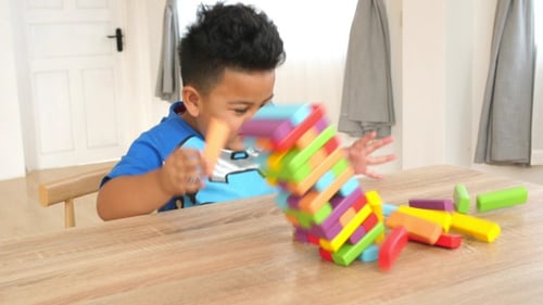 Cute Boy Lost Wood Block Tower Game
