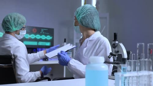 Scientists Collaborating on Medical Research in a Laboratory