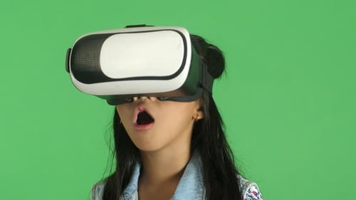 Child Experiencing VR Headset with Surprised Expression