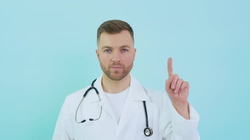 Male Doctor Raises Index Finger for Attention