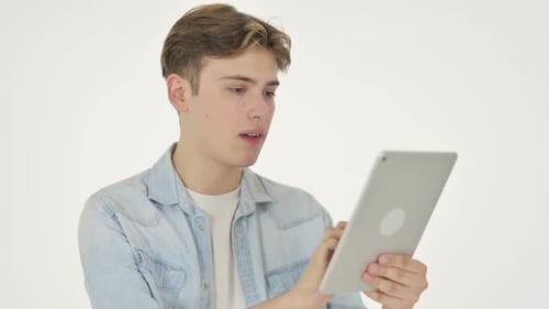 Young Adult Using Tablet is Frustrated