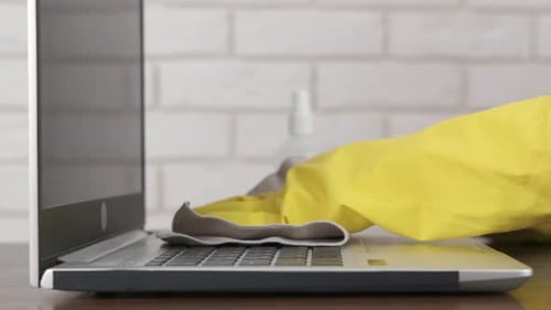Cleaning a Laptop Computer with Spray and Cloth