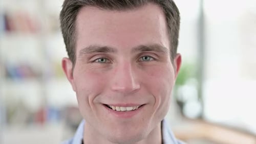 Close Up of Smiling Young Man Face