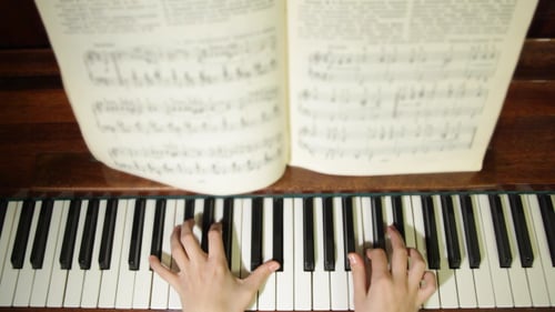 Anonymous Hands Play Piano Keyboard, Overhead Shot