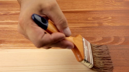 Varnishing Of The Wooden Board